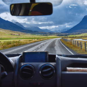 The open road as viewed from behind the wheel of a vehicle