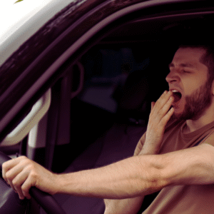 Driver yawning behind the wheel