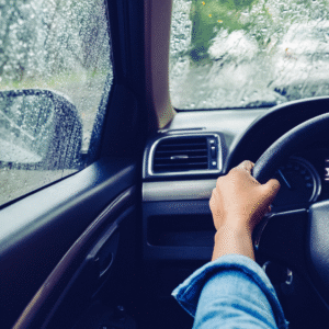 POV shot behind the wheel during bad weather