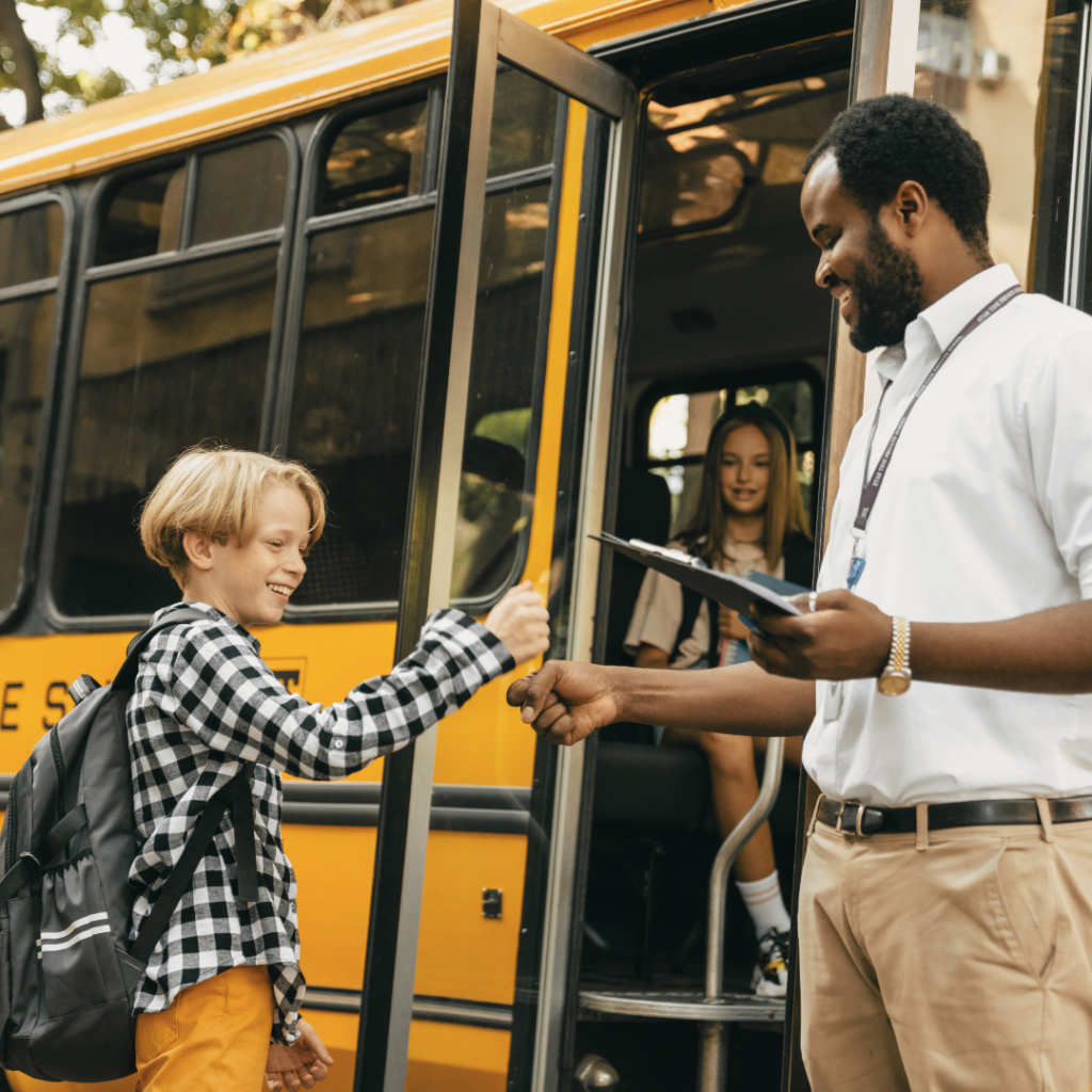 Kid getting onto school bus